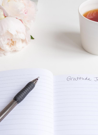 Journal with tea cup and flowers. If you need some encouragement or inspiration to keep going in your faith, this list of Bible verses about God’s faithfulness is for you.